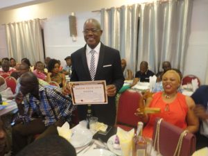 Ngome Blasius beams with smiles and happiness after receiving ASCOM Award as best Communicators for 2016 on hehalf of SONARA