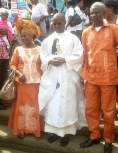 Fr. Ketchen flanked by his proud parents