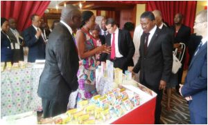 The Minister of Health, Mama Fouda inspecting stand of food products with micronutrients