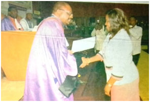 CAMES SG, Prof Bertrand Mbatchi hands certificate to female laureate 