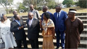  UB principal officers pose with newly commissioned officials