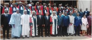 SCC President and Procureur General pose with  Justice Minister Esso and other govt officials 