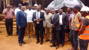 Fako SDO, Engamba Emmanuel Ledoux and Limbe gov't delegate, Motanga Andrew listening from project engineer at project site.