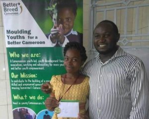 Njie Martha Eyole, winner of Sama Randy writing contest poses with CEO, Otto Paul Akama