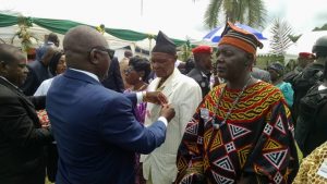 South West Governor, Okalia Bilai joins the minister in decorating CDC workers