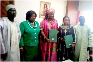  Minister Celestine Ketcha Courtes and Jaji Mbah Rose with signed docs 