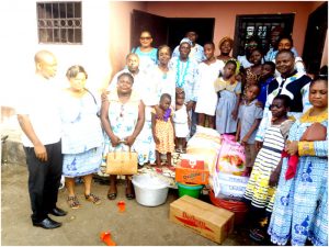   LUCCCUL members pose with orphans of children Full of Grace Orphanage.