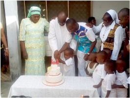 Fr. Ngema cuts ruby jubilee cake 