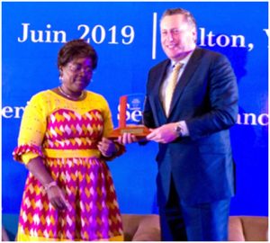 MTN Cameroon CEO, Hendrik Kasteel receives award from Minister Minette Libom 