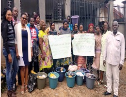 CAWI officials pose with IDP’S after handing kits to them