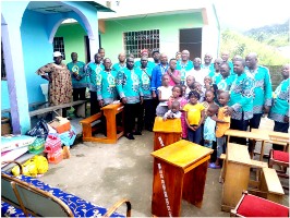 VIHA pose with orphans at CAHECAM orphanage in Limbe 