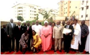 Buyers in Yaounde (lt) and Douala (rt) pose with Minister Ketcha Courtes after receiving their keys