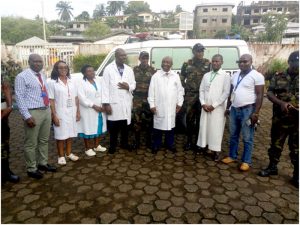 Regional Hospital Limbe staff pose with BIR elements after receiving renovated ambulance