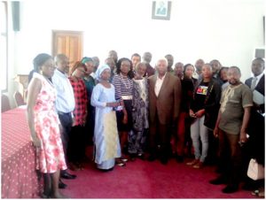 Family photo of participants at the Chamber of Commerce, consultant Ndoumbe (M) 