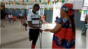  One of the physically challenged  beneficiaries receiving grant from Chief  of Social Centre Buea 