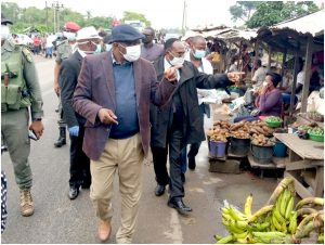  South West Governor, Bernard Okalia Bilai and Regional Delegate for Public Health, Dr. Ebongo Zacheus Nanje sensitizing population on the need to wear face masks 